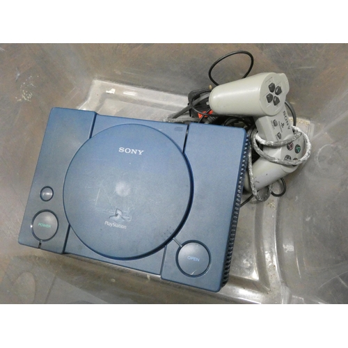 896 - A Sony Playstation with controllers