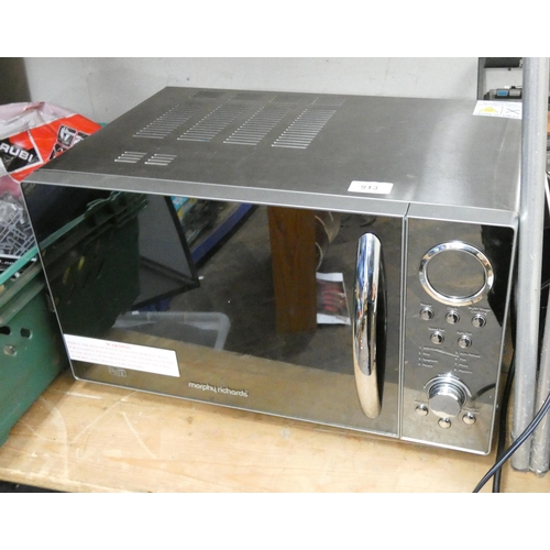 913 - A Morphy Richards microwave oven with mirrored door in silver casing