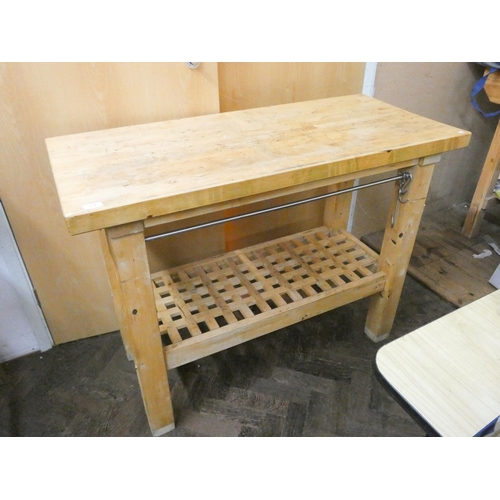 918 - A heavy chunky oak two tier kitchen workstation or work bench with hanging rails attached, 47