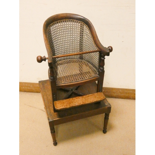 460 - A child's Victorian mahogany framed and cane panelled revolving high chair on mahogany table base