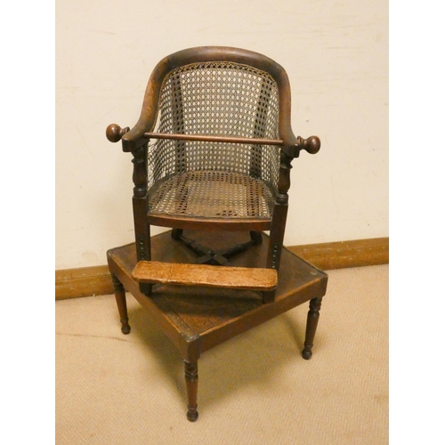 460 - A child's Victorian mahogany framed and cane panelled revolving high chair on mahogany table base