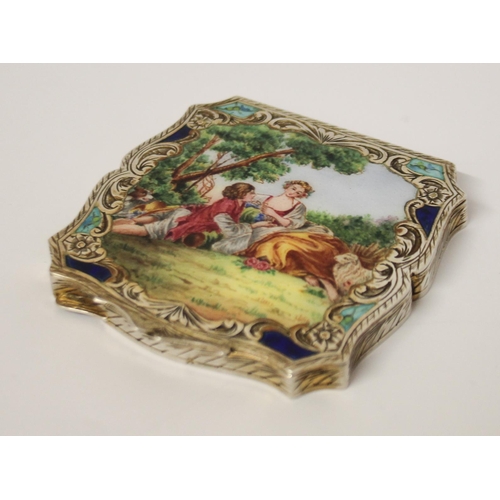 475 - A continental silver and enamel ladies compact, the lid finely enamelled with allegorical romantic s... 