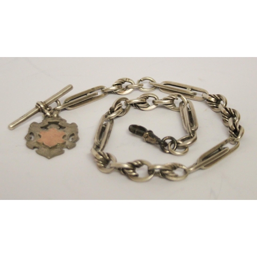 479 - A silver fancy link albert chain with T bar and medallion