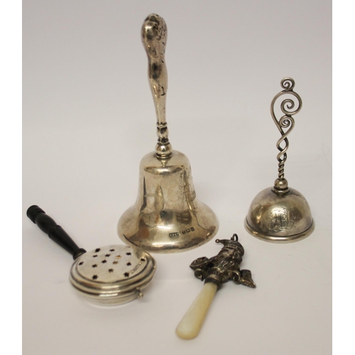 485 - Two hallmarked silver table bells, a miniature novelty bed warmer and an Edwardian silver and mother... 