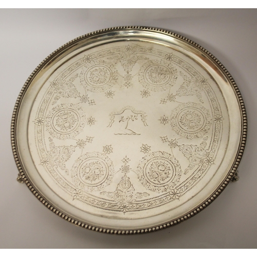 486 - Victorian silver circular salver, with engraved armorial and floral swag decoration. London 1876. 25... 