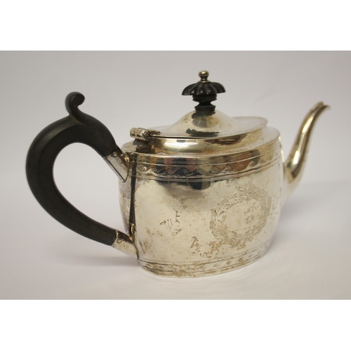 487 - Victorian bachelor's tea pot, with engraved armorial. Sheffield 1857. 9.6 troy ounces all in.