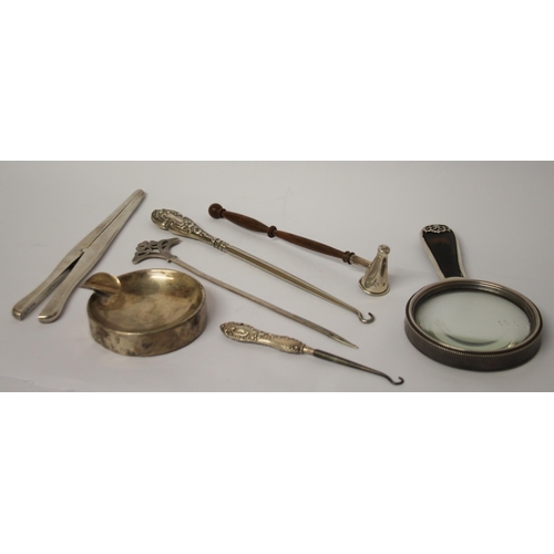 490 - Silver and tortoiseshell hand mirror, silver glove stretchers, button hooks, silver ashtray and a ca... 