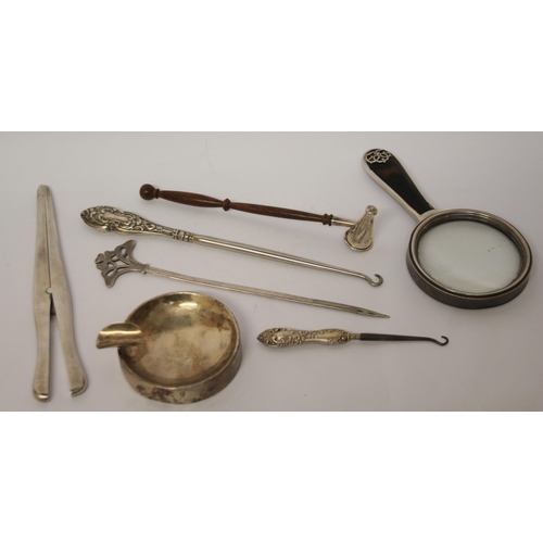 490 - Silver and tortoiseshell hand mirror, silver glove stretchers, button hooks, silver ashtray and a ca... 