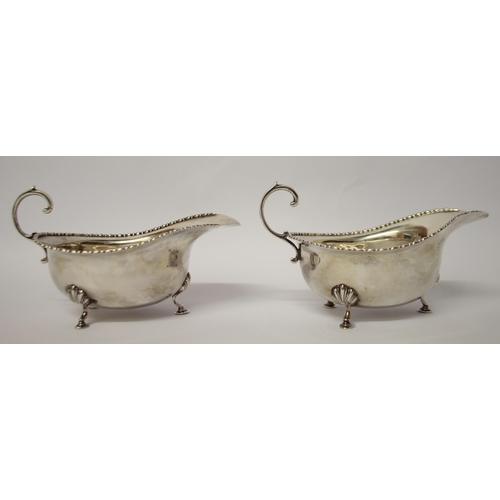 491 - A pair of silver sauceboats, with beaded edge and standing on hoof feet, London 1912. Gross weight 6... 