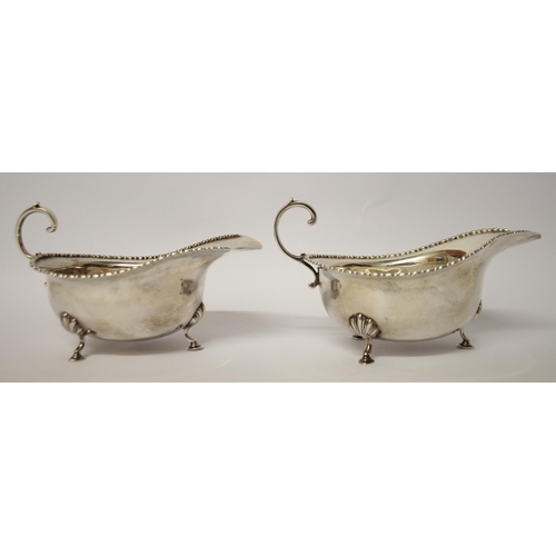 491 - A pair of silver sauceboats, with beaded edge and standing on hoof feet, London 1912. Gross weight 6... 