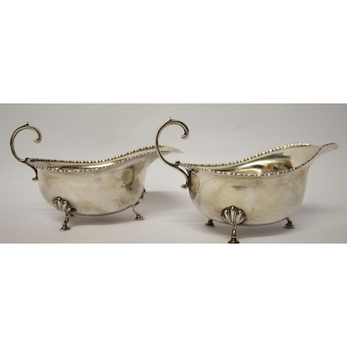 491 - A pair of silver sauceboats, with beaded edge and standing on hoof feet, London 1912. Gross weight 6... 