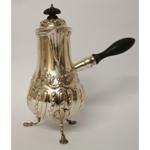 495 - Edwardian silver café au lait pot, with ebony handle and finial, embossed floral and half lobed desi... 