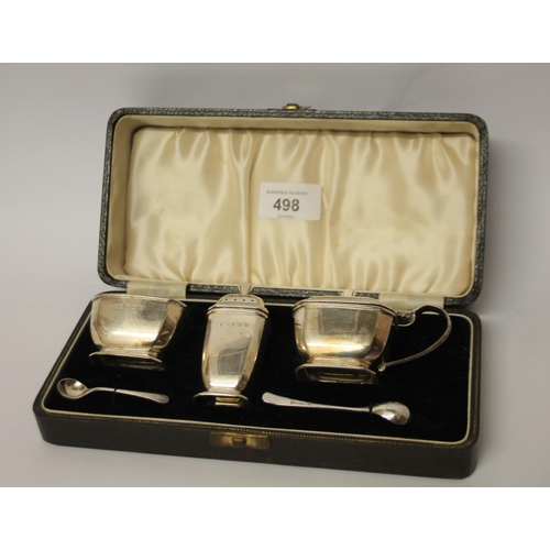 498 - An Art Deco silver cruet set, in fitted case, Birmingham 1938.