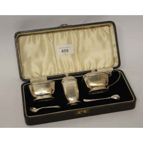 498 - An Art Deco silver cruet set, in fitted case, Birmingham 1938.