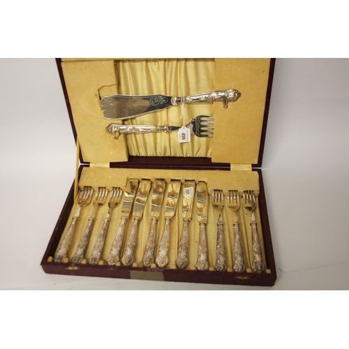 499 - A cased Kings Pattern silver handled fish eaters - set of 6 knives and forks and a set of servers.