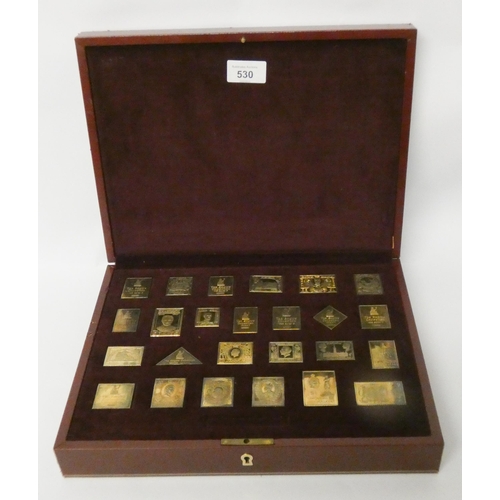 530 - A limited-edition silver-gilt postage stamp ingot set, 