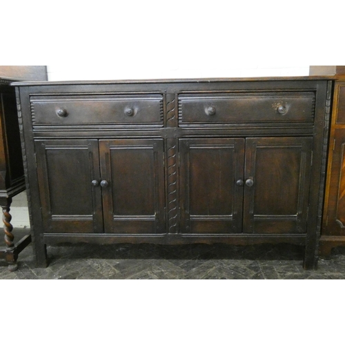 28 - An Ercol oak sideboard fitted two drawers and cupboards, 4'9 wide