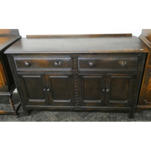 28 - An Ercol oak sideboard fitted two drawers and cupboards, 4'9 wide