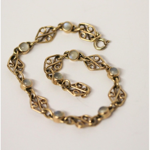 571 - An art nouveau style 9ct gold and moonstone bracelet. 20cms long, gross weight 8 grams