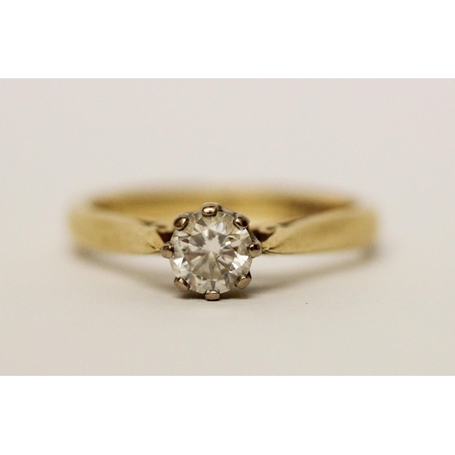 582 - A solitaire diamond ring, the claw set brilliant cut diamond weighing 0.5 carats, on hallmarked 18ct... 