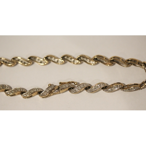 588 - A modern 9ct yellow gold and diamond set bracelet, 19cms long, gross weight 7.2 grams