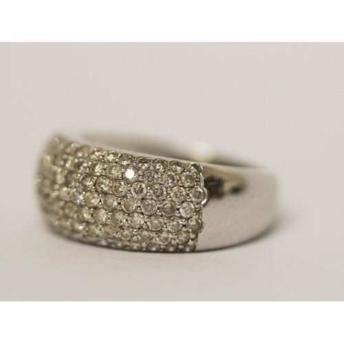 591 - A modern wide diamond set band on hallmarked 18ct white gold, ring size M