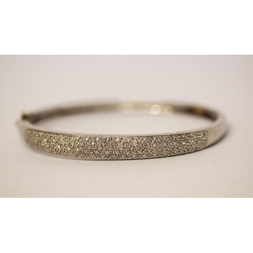 592 - Modern diamond pave set bangle, hinged 9ct white gold with 0.5 carats of diamonds, weight 11.5 g