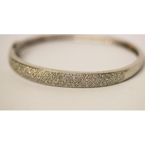 592 - Modern diamond pave set bangle, hinged 9ct white gold with 0.5 carats of diamonds, weight 11.5 g