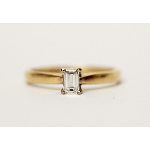 598 - 18ct yellow gold solitaire diamond ring, set with an emerald cut diamond of one third of a carat, ha... 