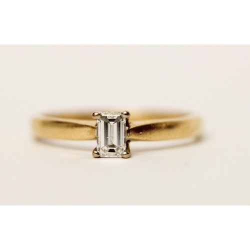 598 - 18ct yellow gold solitaire diamond ring, set with an emerald cut diamond of one third of a carat, ha... 