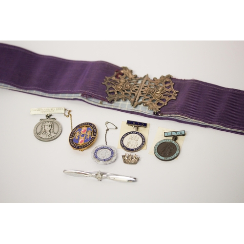 623 - A nurse belt and buckle, various presentation badges & medallions, RAF wings badge and a silver cres... 