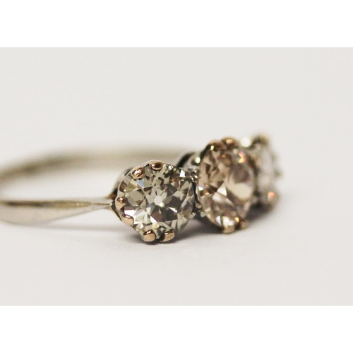 625 - Three stone diamond ring set with three old brilliant cut diamonds, total carat weight estimated to ... 