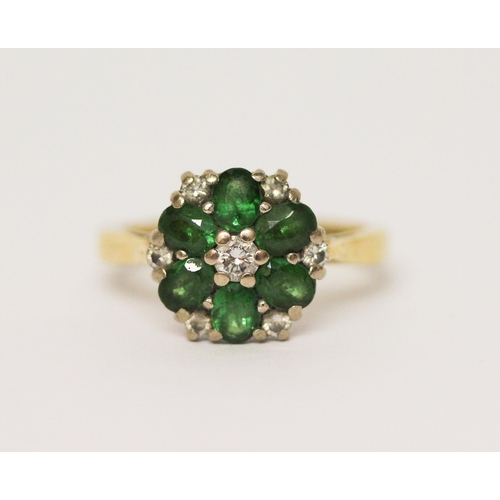 628 - An emerald and diamond cluster ring, on 18ct yellow gold band. Hallmarked, ring size J