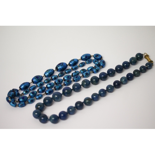 635 - A row of vintage Murano peacock glass beads and a row of lapis beads with gilt metal filigree clasp