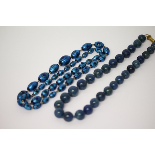 635 - A row of vintage Murano peacock glass beads and a row of lapis beads with gilt metal filigree clasp