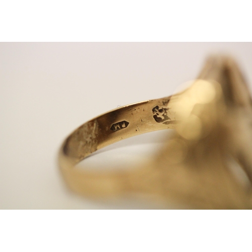 636 - A gents 9ct gold horseshoe and horse head design dress ring, hallmarked. Ring size U. Weight 8 grams