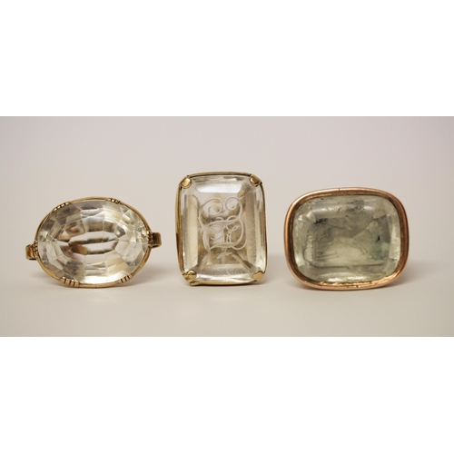 637 - A collection of three Victorian seal fobs, set with  rock crystal panels, two of which are carved.