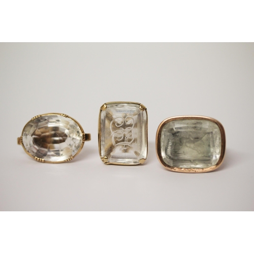 637 - A collection of three Victorian seal fobs, set with  rock crystal panels, two of which are carved.