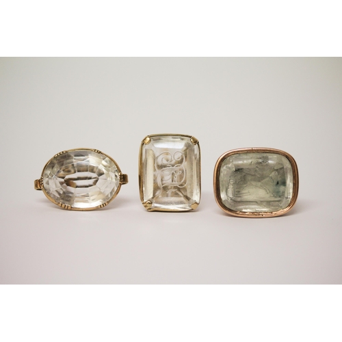 637 - A collection of three Victorian seal fobs, set with  rock crystal panels, two of which are carved.