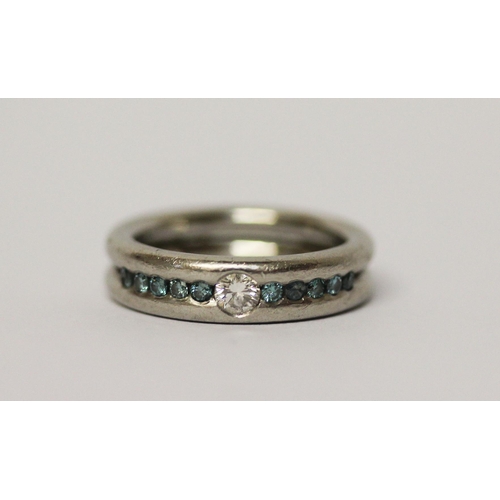 647 - Modern platinum and diamond band, set with white and blue diamonds, hallmarked, ring size L. Gross w... 