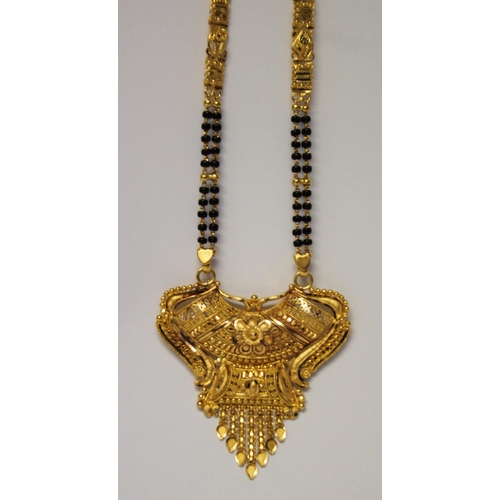 655 - Indian high carat gold fringe pendant necklace, the ornate pendant suspended from gold and onyx bead... 