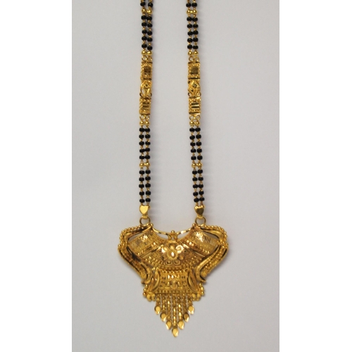 655 - Indian high carat gold fringe pendant necklace, the ornate pendant suspended from gold and onyx bead... 