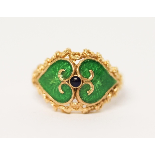 657 - Indian yellow gold dress ring with green enamel decoration, shank marked 750. Ring size M