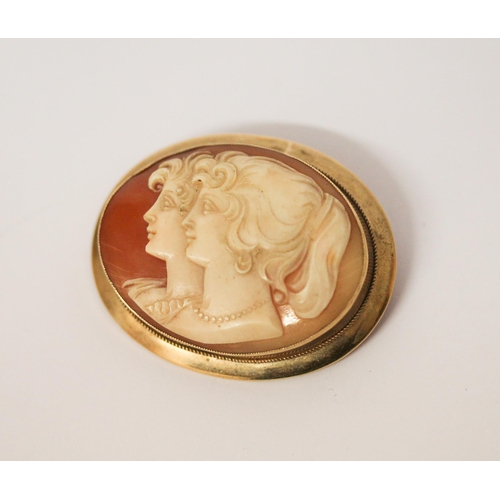 661 - An oval shell cameo brooch, carved with two ladies in profile, in hallmarked 9ct gold mount. Width 4... 