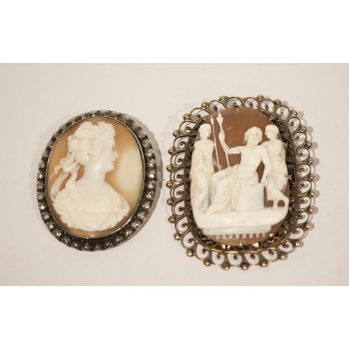 665 - Two vintage silver framed carved shell cameo brooches, largest measures 6.5 cms including frame