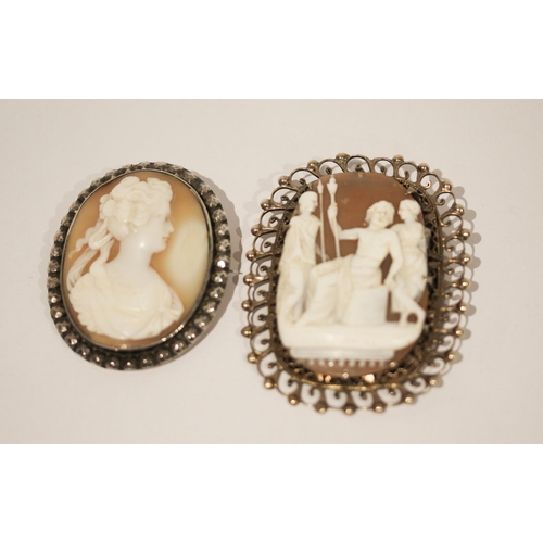 665 - Two vintage silver framed carved shell cameo brooches, largest measures 6.5 cms including frame