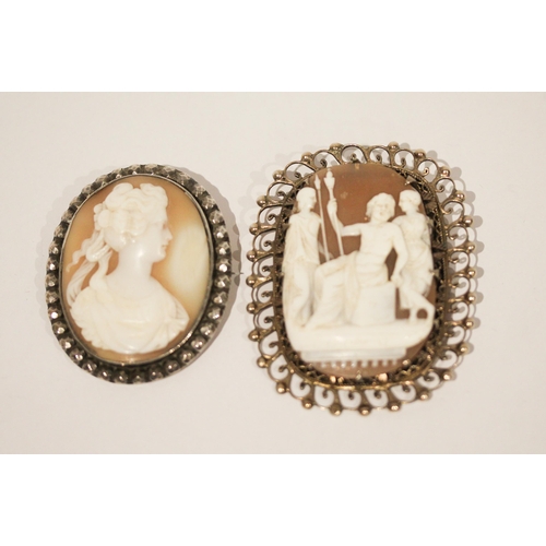 665 - Two vintage silver framed carved shell cameo brooches, largest measures 6.5 cms including frame