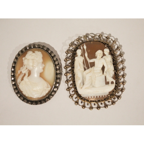 665 - Two vintage silver framed carved shell cameo brooches, largest measures 6.5 cms including frame