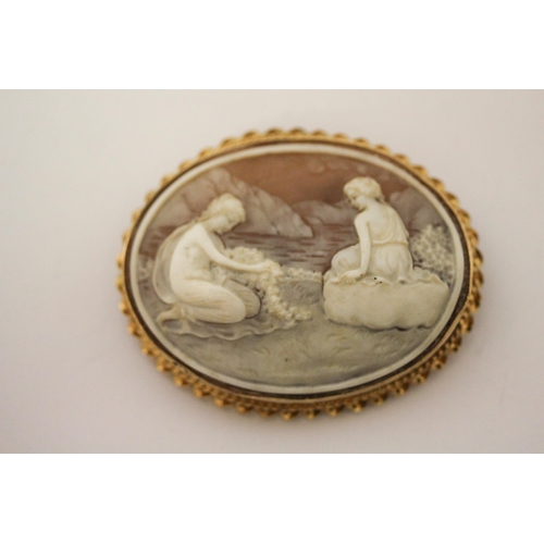 668 - An oval carved shell cameo depicting two nymphs by a lake, in hallmarked 9ct gold frame, 6cms approx