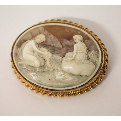 668 - An oval carved shell cameo depicting two nymphs by a lake, in hallmarked 9ct gold frame, 6cms approx